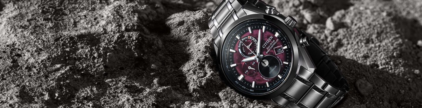 Men's Super Titanium watches, featuring Tsuki-yomi A-T watch model BY1018-55X on a rock background